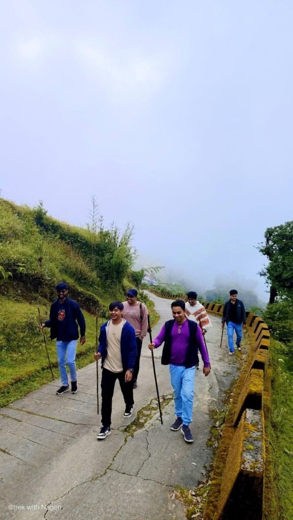 Guests walking the village road in the mist
