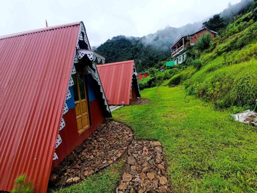 Red A-frame cabins at Gurdum